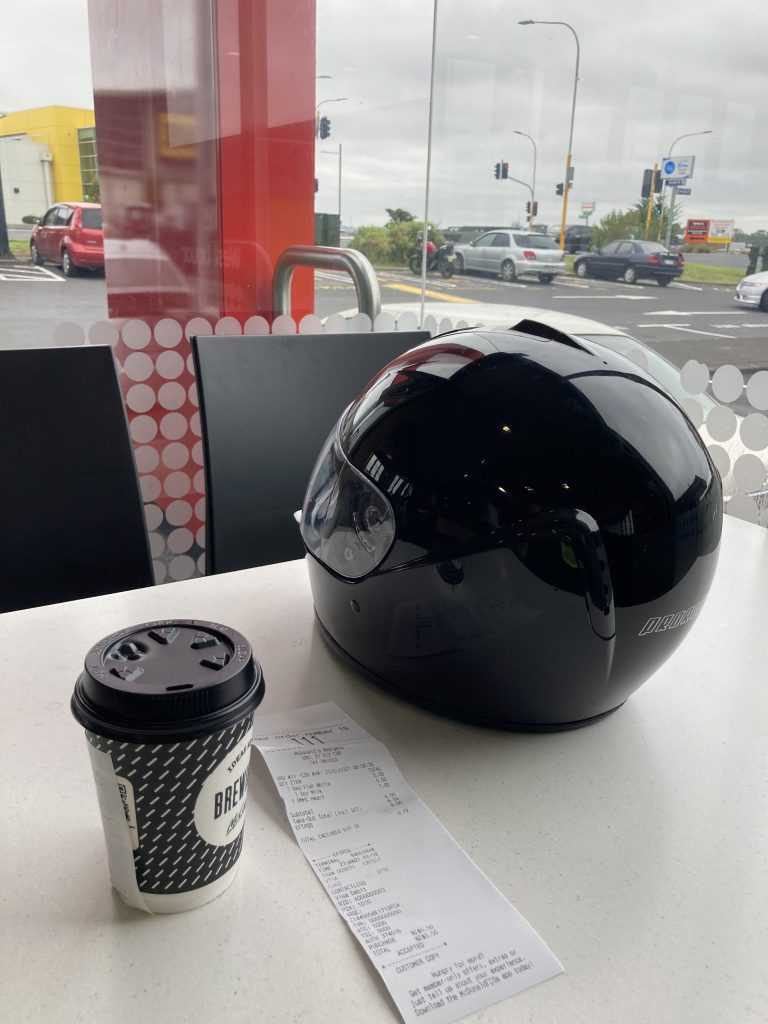Photo of my coffee and motorcycle helmet